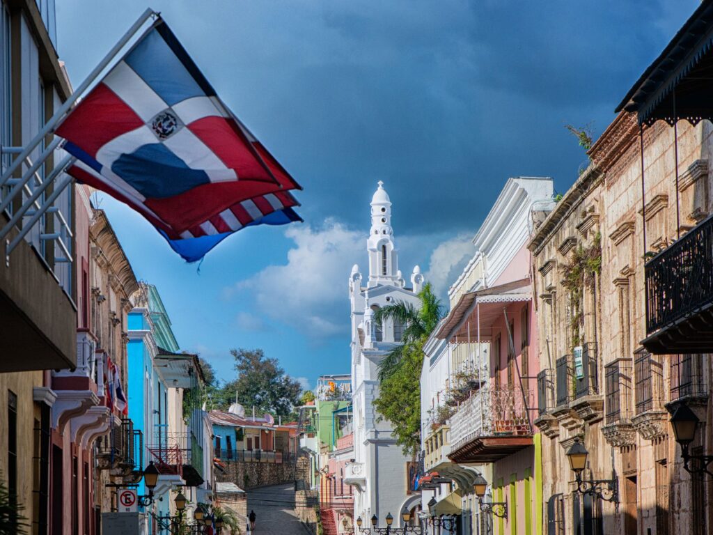 Colorful Dominican street with a Dominican Flag