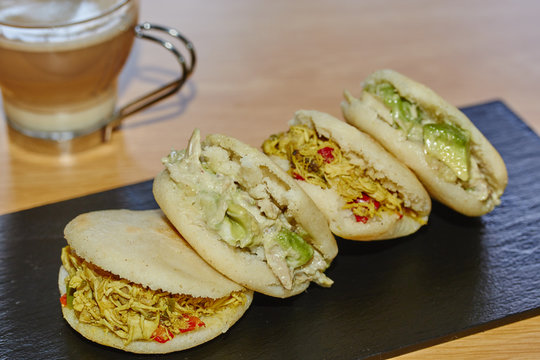 arepas with meat and salad